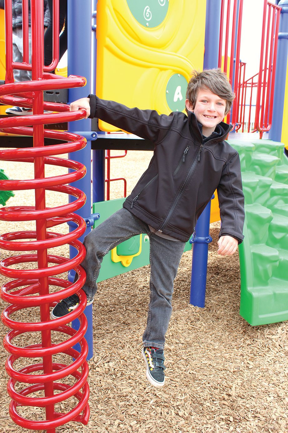 New Market student Derek Ward hangs out on the new playground.